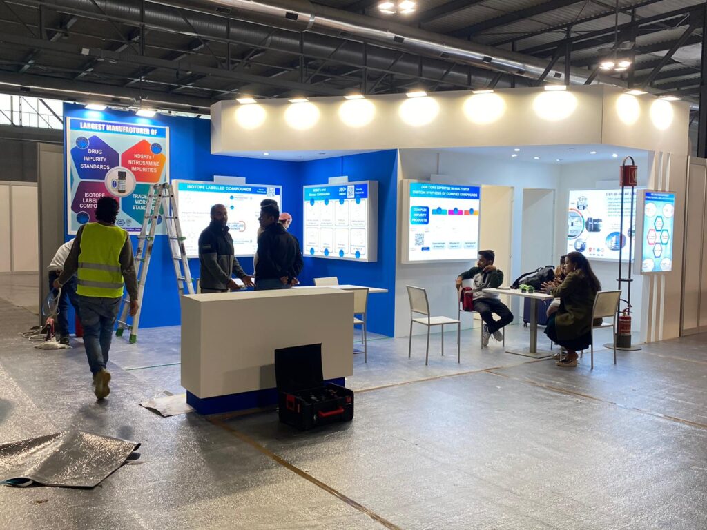 At CPHI Milan, when a last-minute stall requirement came in from renowned pharmaceutical brand Simson Pharma, the Expolens Exhibitions team rose to the challenge without hesitation. Despite tight deadlines and logistical pressure, our experienced design and fabrication team managed to conceptualize, produce, and install a custom-built stall—all within a remarkably short timeline. The result? A visually striking and functional space that reflected Simson Pharma’s global presence and innovation-driven identity.